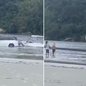 Carro ficou parcialmente submerso após atolar na faixa de areia da Praia da Enseada, em Bertioga, nesta sexta-feira (11). O veículo foi retirado pelo proprietário e ninguém ficou ferido - Imagem: Reprodução/Redes Sociais